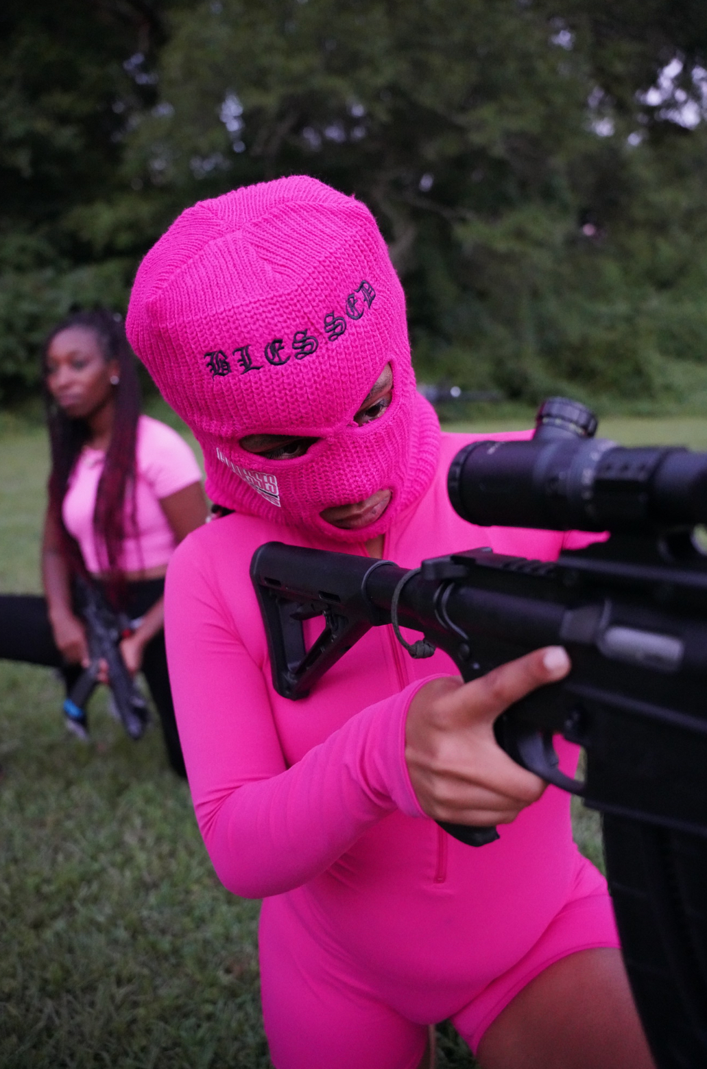 Warrior Goddess in pink balaclava with rifle